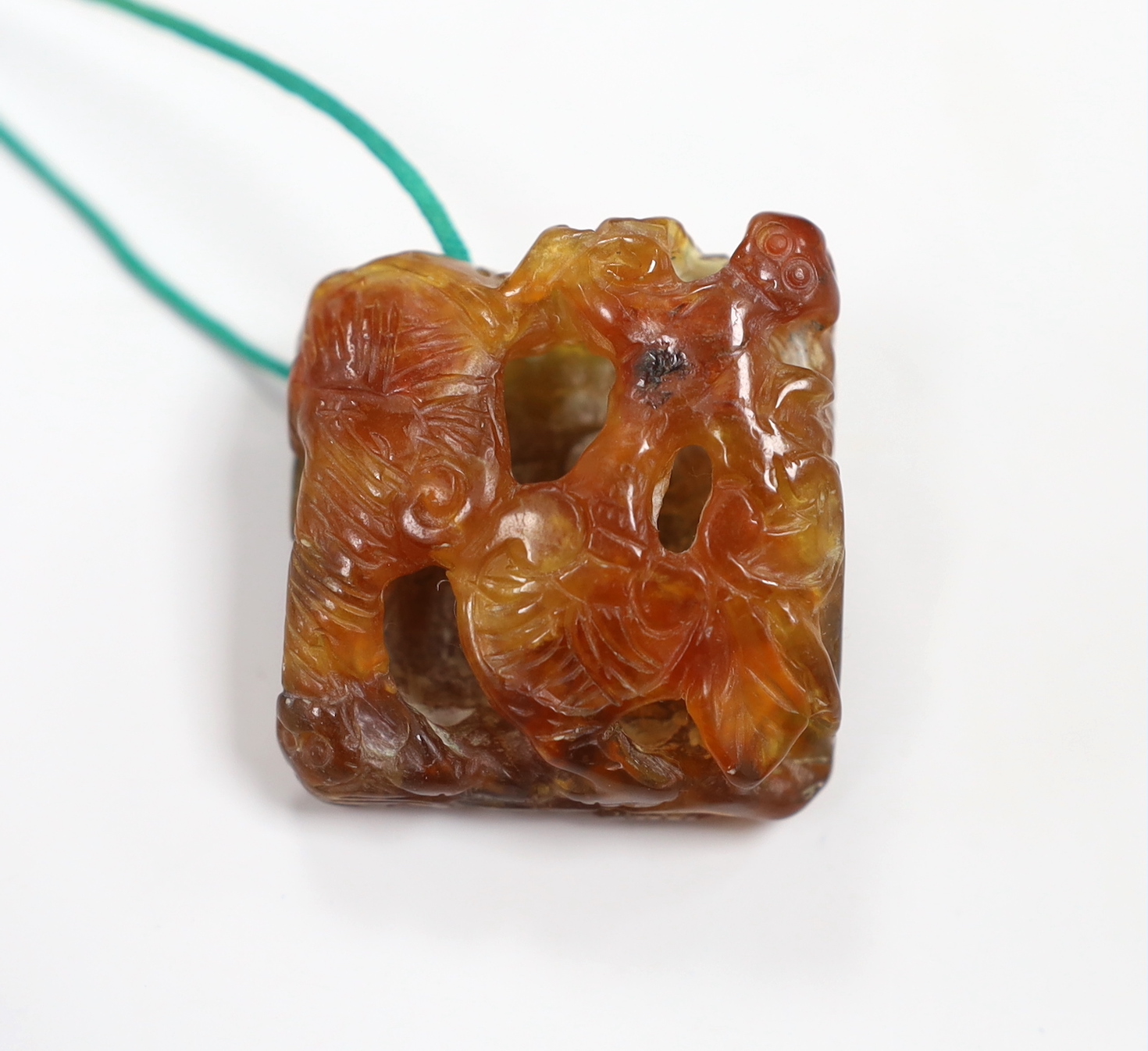 A Chinese chalcedony 'bats and lingzhi' carving , Qing dynasty, 3.5cm